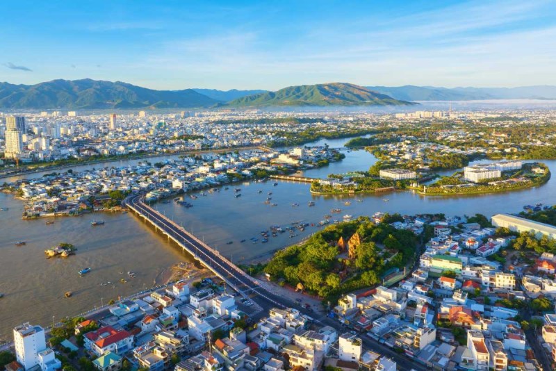 Aerial View of Cai River and Nha Trang City Aerial view showing winding Cai River flowing through Nha Trang city with bridges and buildings