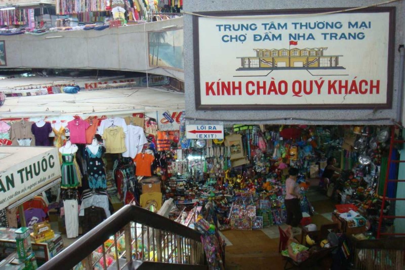 Dam Market Nha Trang Indoor Shopping Area Indoor view of Dam Market in Nha Trang featuring crowded stalls selling clothes and souvenirs
