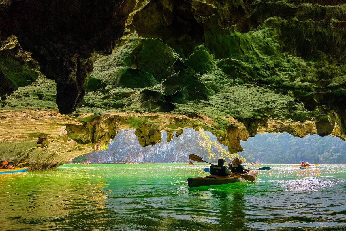 Kayakers exploring Ba Hang Fishing Village