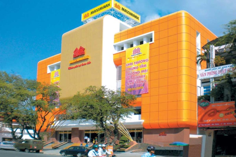 Maximark Nha Trang Shopping Center Bright Facade Maximark shopping center in Nha Trang with bright orange facade and parking area