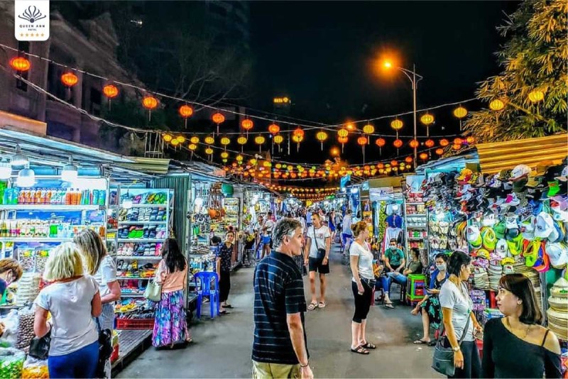 Nha Trang Night Market Vibrant Evening Shopping Experience Bustling Nha Trang Night Market at night with colorful lanterns and diverse street stalls offering local goods