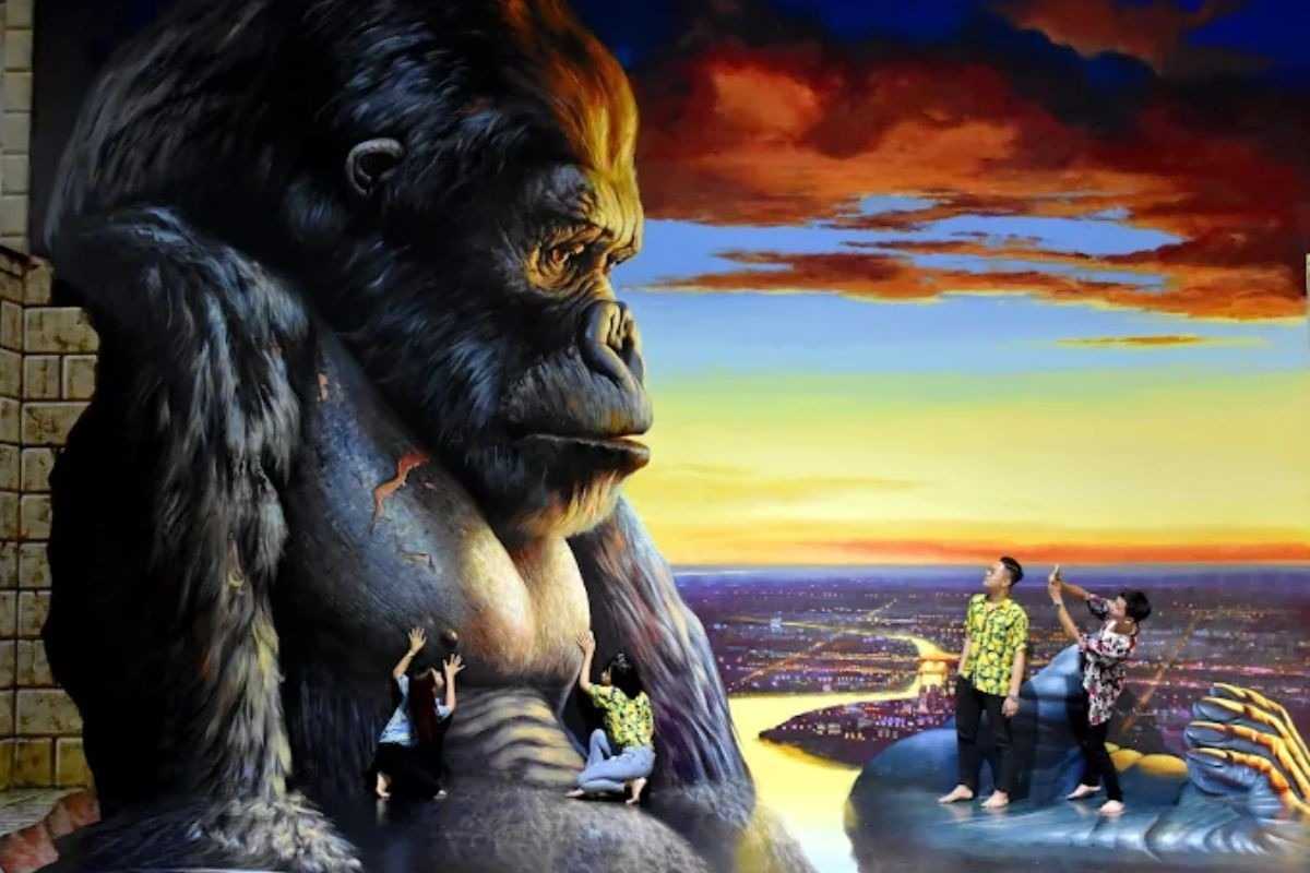 3D Museum Art in Paradise Da Nang King Kong mural cityscape experience 3D Museum Art in Paradise Da Nang allows visitors to pose with a giant King Kong mural overlooking a sunset cityscape in the fantasy zone.
