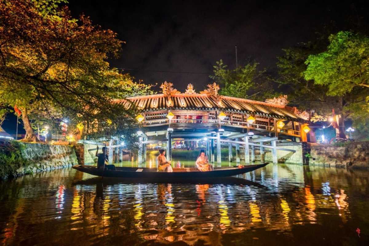 Overhead Aerial View of Thanh Toan Bridge Aerial perspective showing Thanh Toan Bridge spanning over calm water in a rural Hue setting