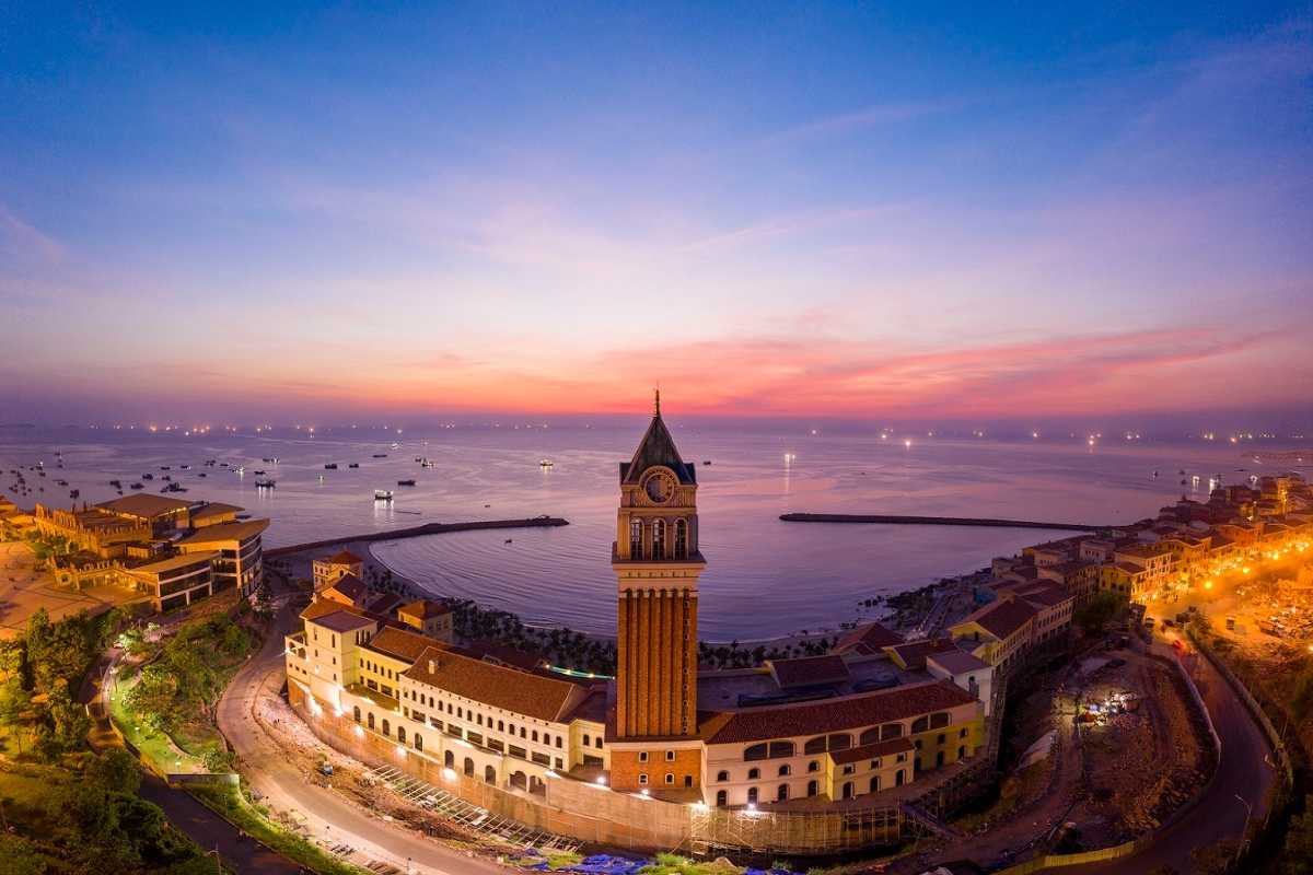 Aerial View of Clock Tower Phu Quoc at Sunset Aerial sunset view of Clock Tower Phu Quoc overlooking the bay and coastal buildings