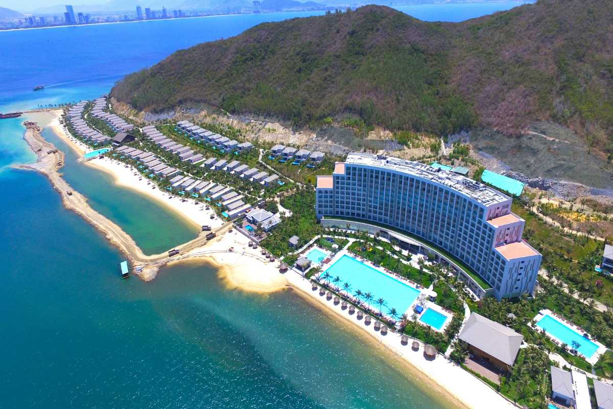 Aerial view of Nha Trang Bay coastline and resorts Aerial photo of coastline and resorts along Nha Trang Bay with lush greenery