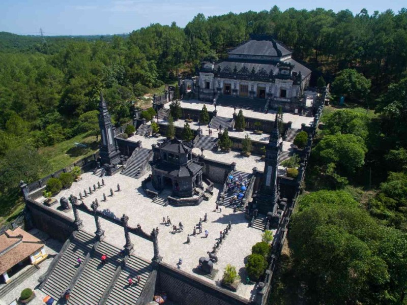 Aerial view of the majestic Khai Dinh Tomb set amidst the lush greenery of Hue.