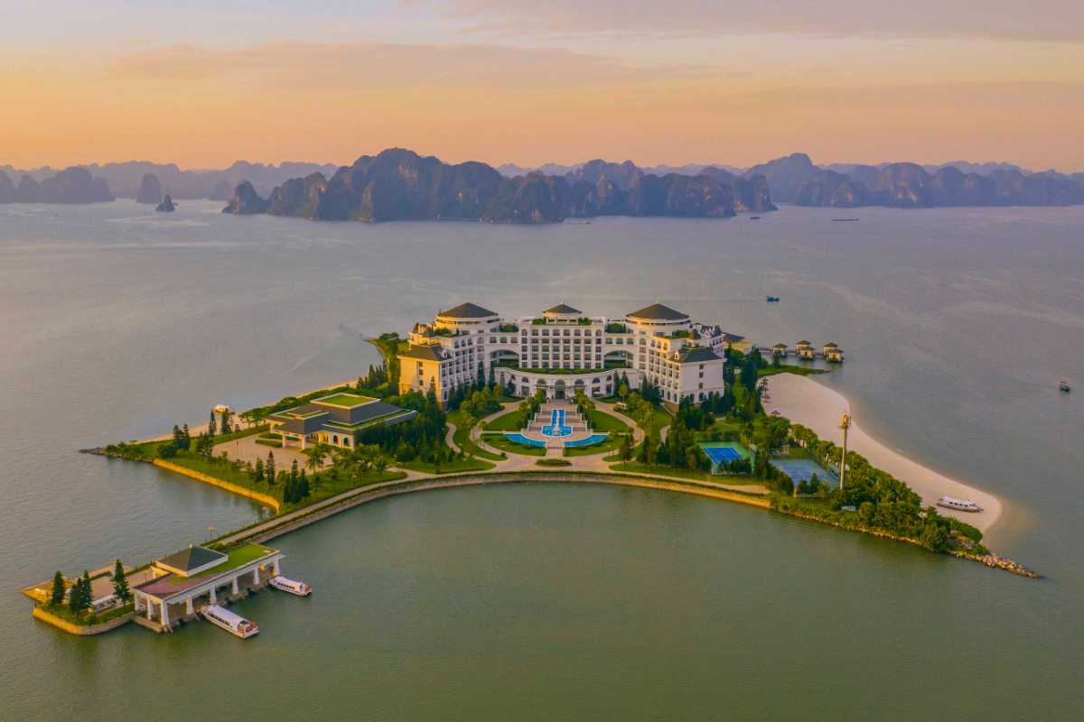 Aerial View Soi Sim Island Halong Bay Resort and Beach Aerial shot showing the resort and beach area of Soi Sim Island Halong Bay surrounded by green hills