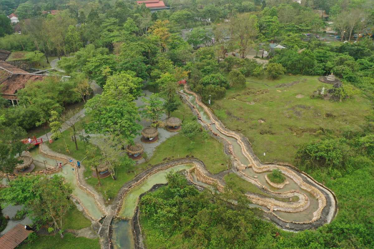 Aerial View of Hot Spring Baths and Trails Overhead view showing hot spring baths, walking trails, and natural forest at Alba Thanh Tan