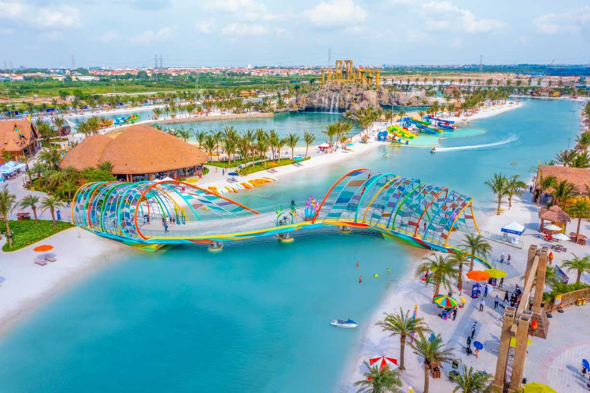 Alba Thanh Tan Hot Springs Colorful Bridge View Colorful curved pedestrian bridge over lagoon at Alba Thanh Tan Hot Springs in Hue