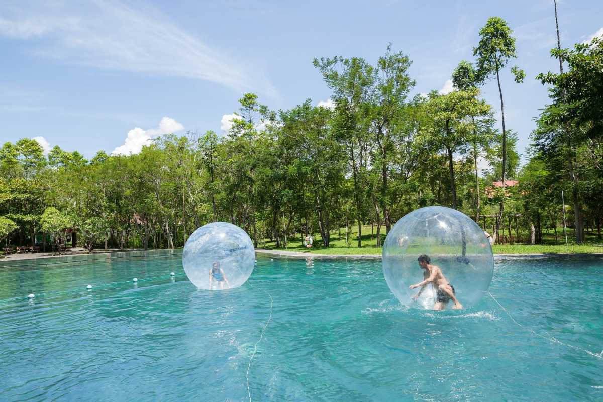 Water Ball Adventure at Alba Thanh Tan Hot Springs Two visitors inside transparent water balls floating on a pool at Alba Thanh Tan Hot Springs