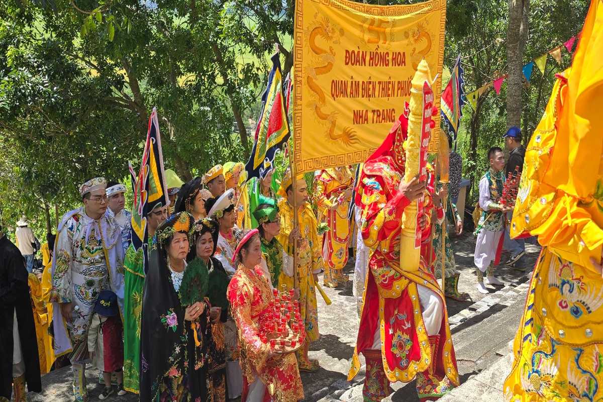 Am Chua Festival ceremonial procession Traditional ceremonial procession at Am Chua Festival with participants in colorful ancestral costumes.