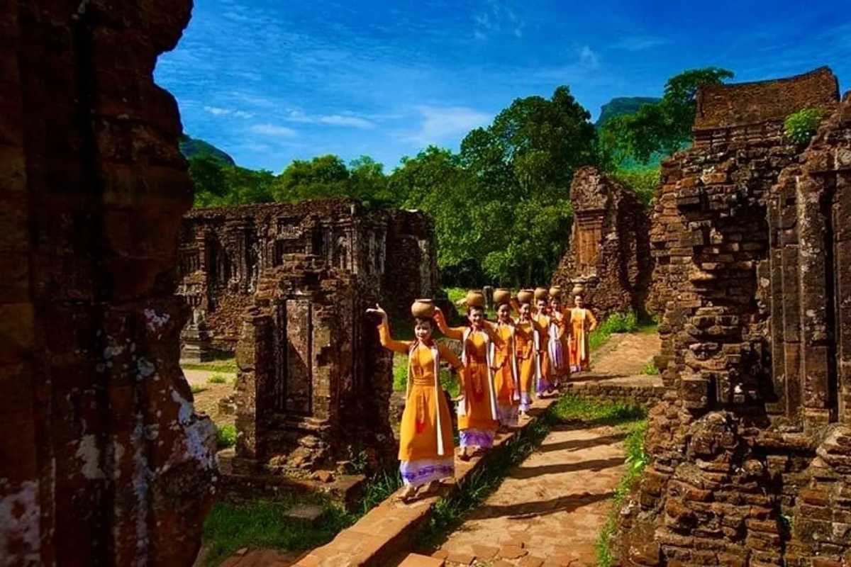Ancient Cham Ruins at My Son Sanctuary Vietnam Detailed view of ancient Cham ruins surrounded by greenery at My Son Sanctuary Vietnam, showcasing heritage architecture and historical significance