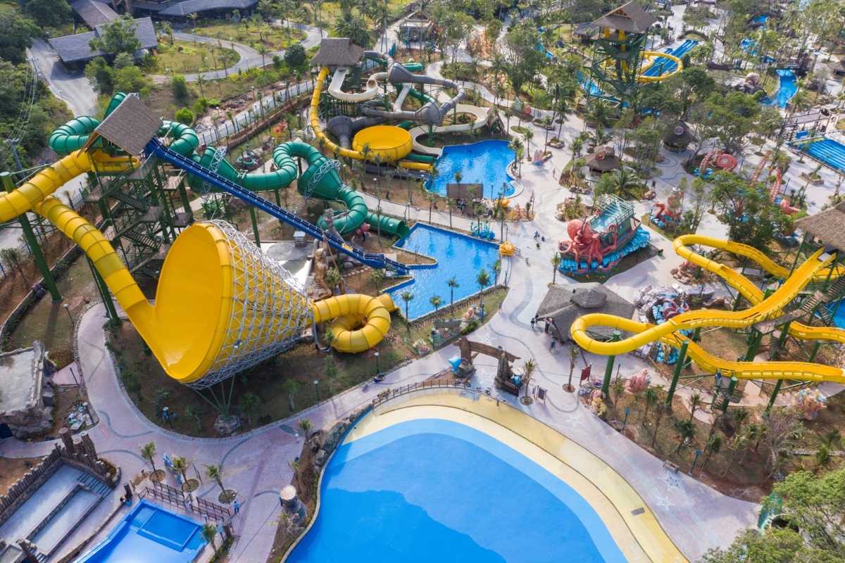 Families Enjoying Pools at Aquatopia Water Park Families having fun in the splash pool at Aquatopia Water Park, Hon Thom Island Phu Quoc