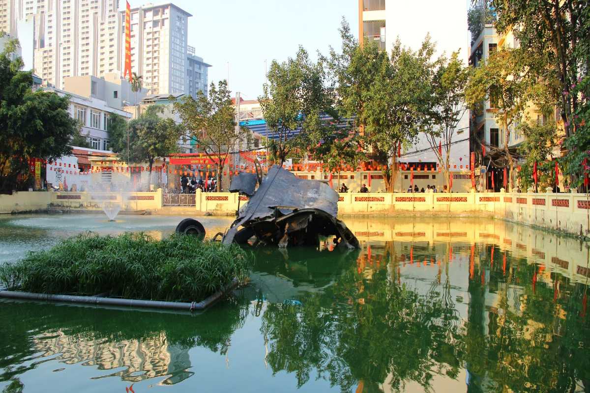 B-52 Wreckage and Reflection in Huu Tiep Lake B-52 bomber wreckage reflected in the calm green water of Huu Tiep Lake Hanoi