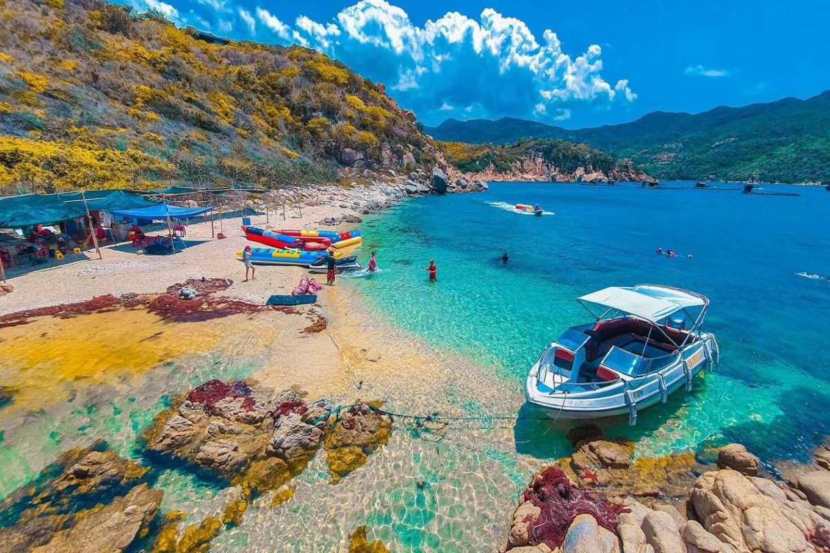 Ba Dien Beach People Swimming and Boating People swimming and boating in clear waters at Ba Dien Beach, Ninh Thuan