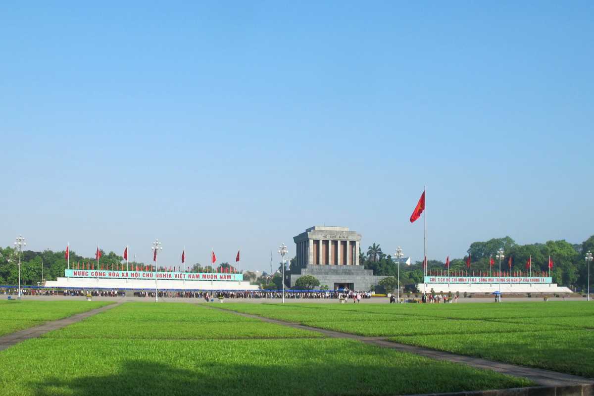 Ba Dinh Square Hanoi - Morning Flag Ceremony The flag raising ceremony taking place at Ba Dinh Square Hanoi, with crowds attending the Ho Chi Minh Mausoleum.