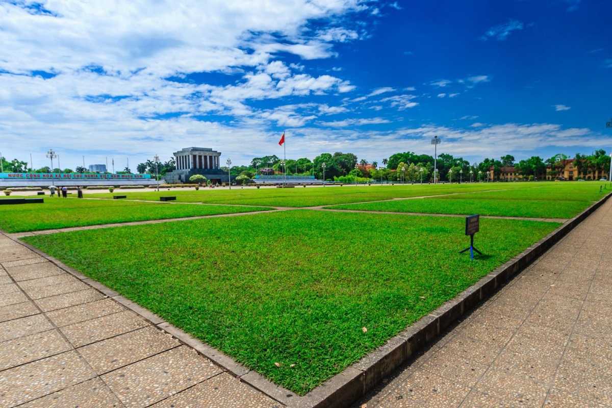 Ba Dinh Square Hanoi - Flag Ceremony and Visitors Visitors watching the flag raising ceremony at Ba Dinh Square Hanoi, with the Ho Chi Minh Mausoleum in the background.