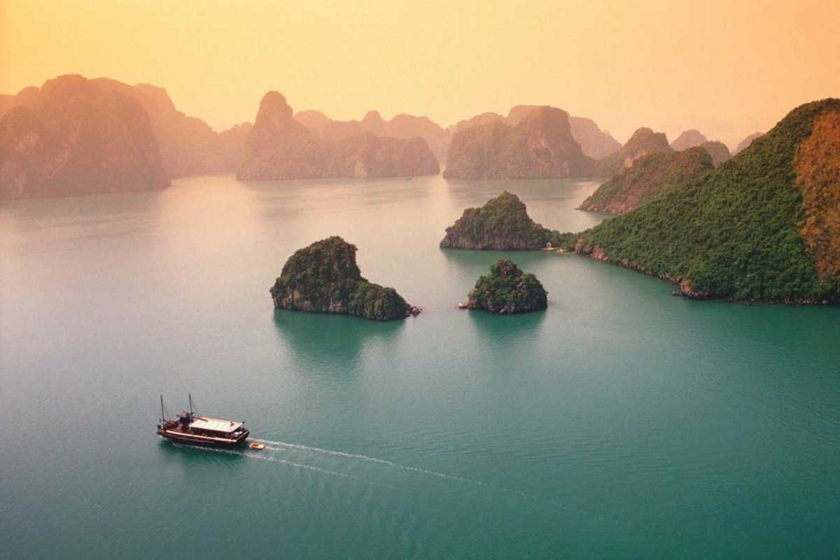 Ba Ham Lake Halong Bay aerial view of scenic limestone karsts Aerial view of Ba Ham Lake Halong Bay featuring dramatic limestone karsts rising from emerald green waters.