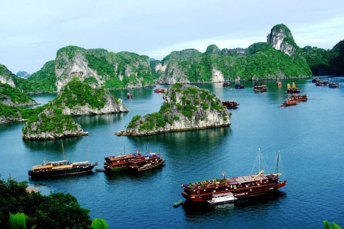 Ba Ham Lake Halong Bay Scenic Landscape with Limestone Islands Scenic landscape featuring Ba Ham Lake Halong Bay with limestone islands and boats on calm waters