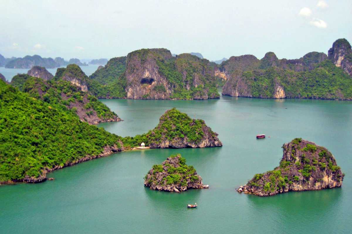 Ba Ham Lake Halong Bay scenic lookout over islands Scenic lookout at Ba Ham Lake Halong Bay offering panoramic views of limestone islands and emerald waters.