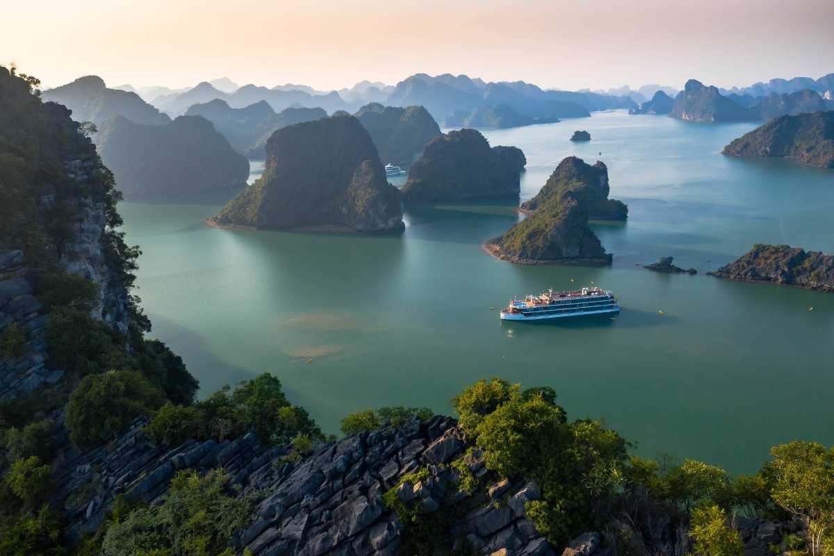Ba Ham Lake Halong Bay Serene Freshwater Lake Surrounded by Karsts Serene freshwater lake surrounded by towering limestone karsts at Ba Ham Lake Halong Bay