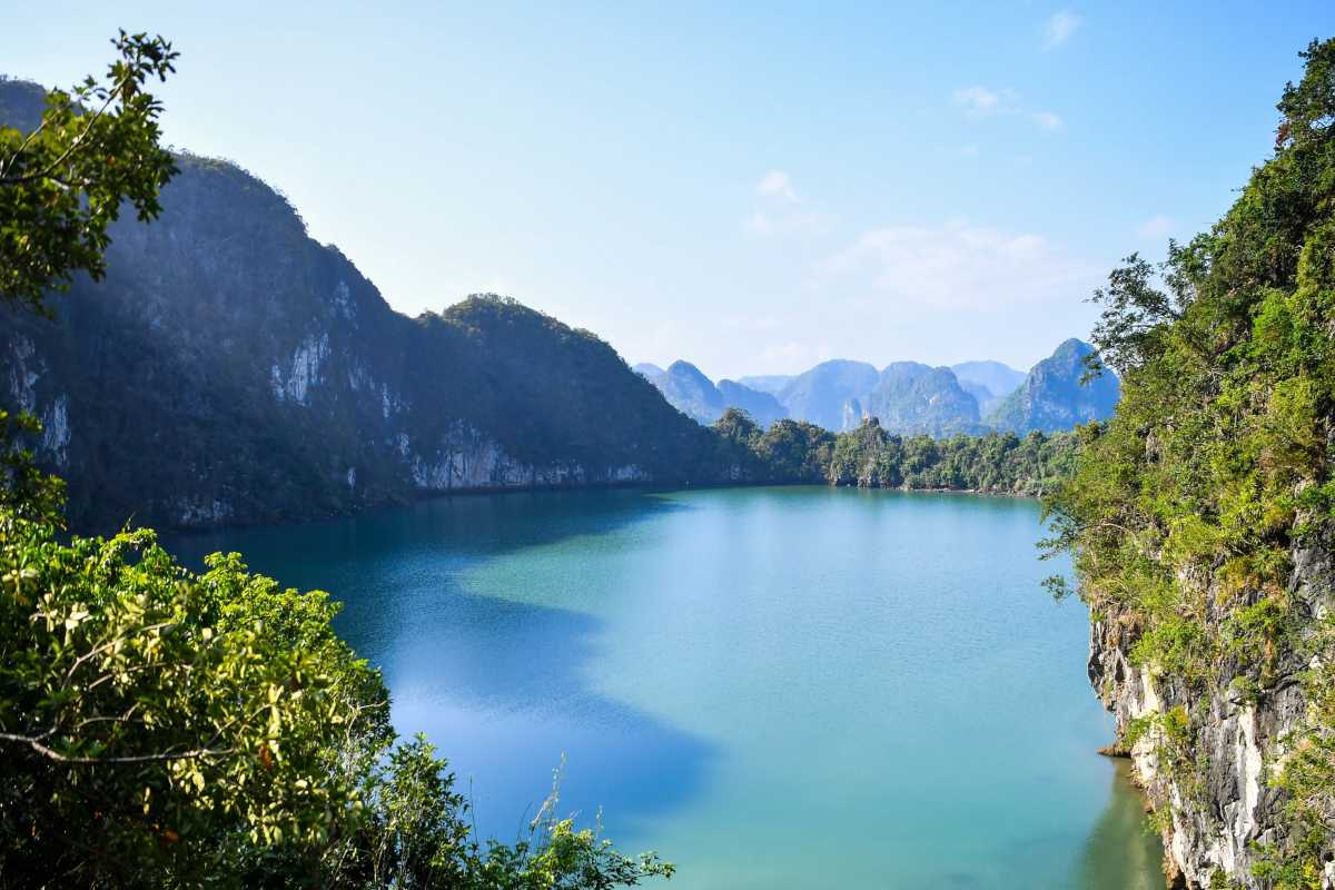 Ba Ham Lake Halong Bay Tourist Boats Cruising Among Limestone Islands Tourist boats navigating Ba Ham Lake Halong Bay with limestone islands in the background