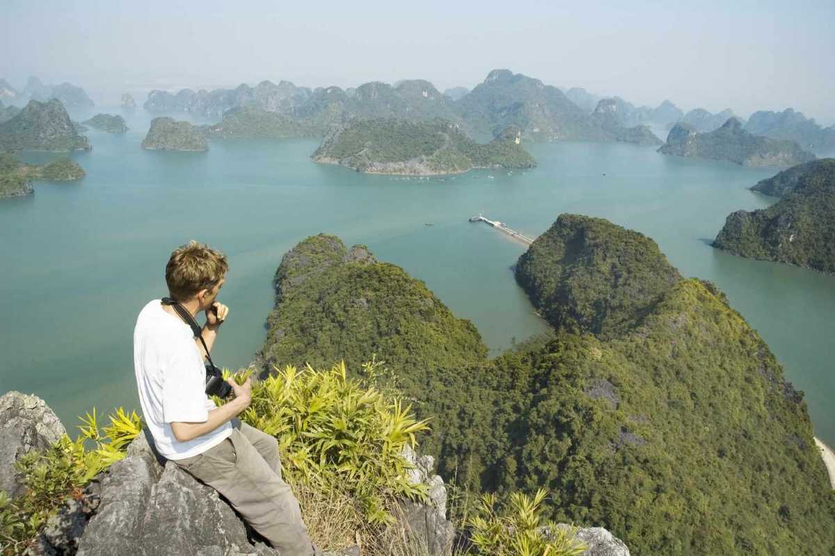 Ba Ham Lake Halong Bay Traditional Junk Boat Sailing Traditional junk boat sailing gracefully through Ba Ham Lake Halong Bay’s emerald waters