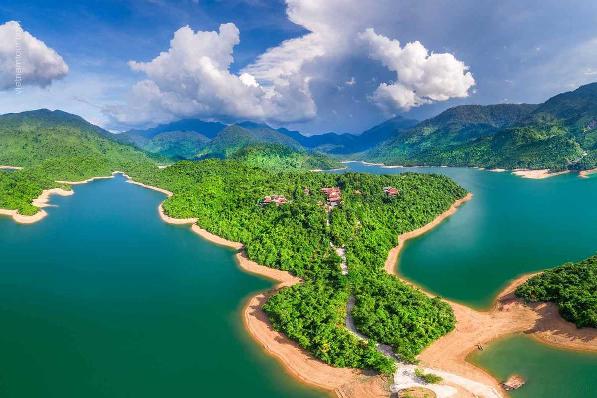 Scenic Lake and Peninsula in Bach Ma National Park Wide aerial view of a green peninsula surrounded by blue lake waters within Bach Ma Park