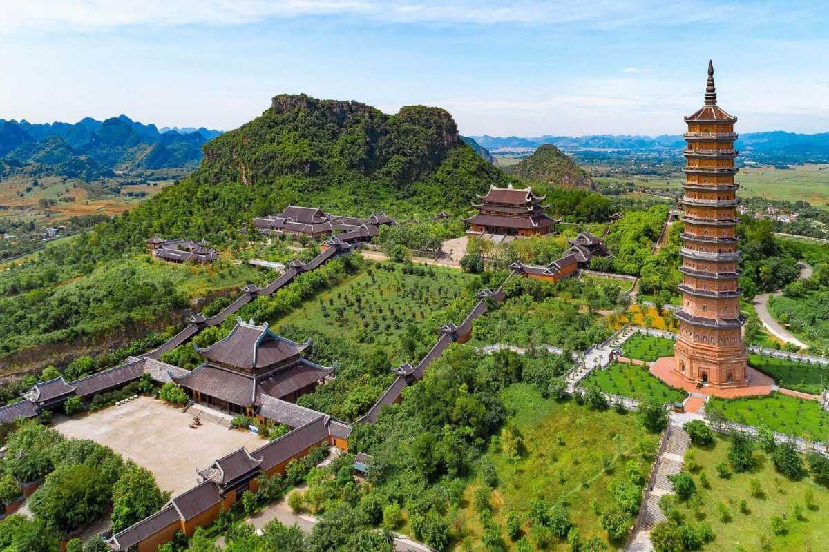 Bai Dinh Pagoda Ninh Binh aerial view of temple and green hills Aerial view of Bai Dinh Pagoda Ninh Binh, showing traditional temple roofs nestled among green hills and scenic valleys