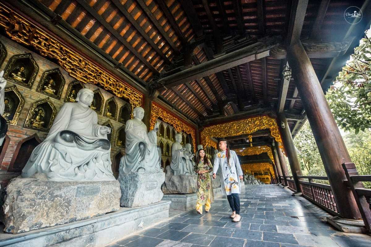 Bai Dinh Pagoda Ninh Binh Arhat Corridor and Buddhist statues Bai Dinh Pagoda Ninh Binh Arhat Corridor displays rows of intricately carved Buddhist stone statues in golden light