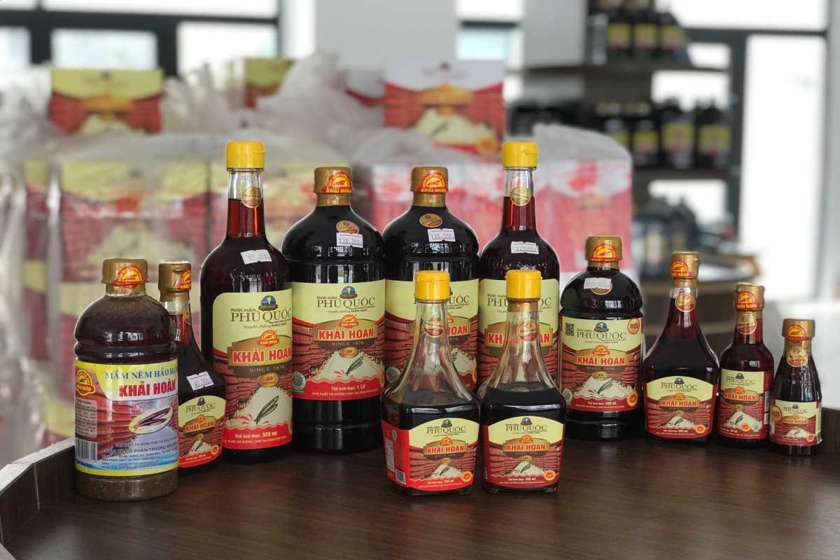 Fermentation Barrels and Plastic Containers Mixture of traditional barrels and modern containers in Phu Quoc fish sauce factory