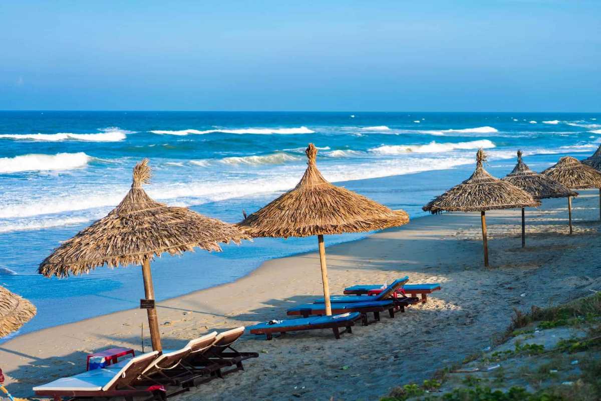 Beach Loungers and Umbrellas on An Bang Beach Rows of beach loungers and umbrellas along the sandy shore with gentle waves