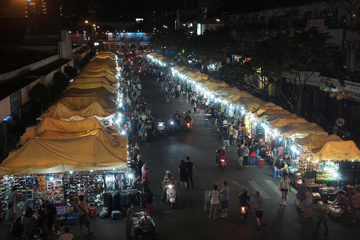 Aerial night view of Ben Thanh Market and illuminated stalls Aerial nighttime view of Ben Thanh Market and surrounding illuminated stalls and streets