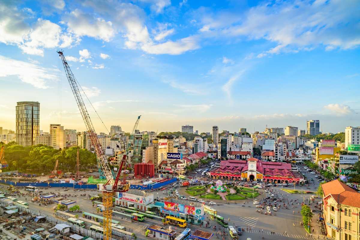 Aerial view of Ben Thanh Market and surrounding cityscape Aerial view of Ben Thanh Market and the bustling cityscape of Ho Chi Minh City under a blue sky