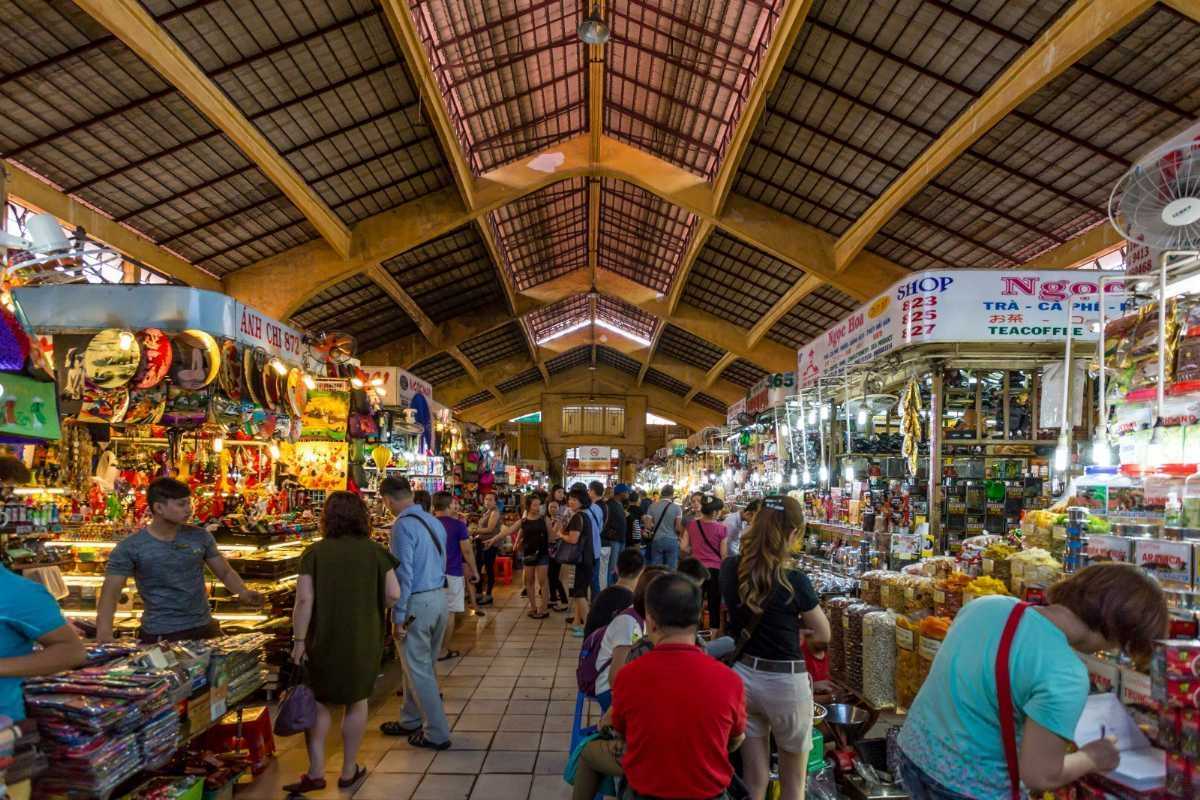 Night view of Ben Thanh Market illuminated with neon lights Nighttime view of Ben Thanh Market glowing with neon lights and bustling nightlife
