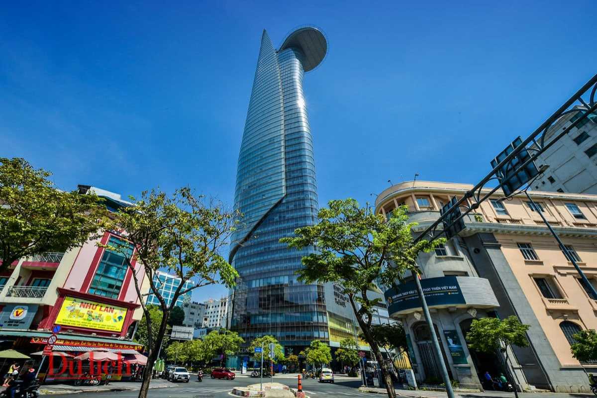 Exterior View of Bitexco Tower from Street Level Street-level view of Bitexco Tower soaring above surrounding buildings in Ho Chi Minh City