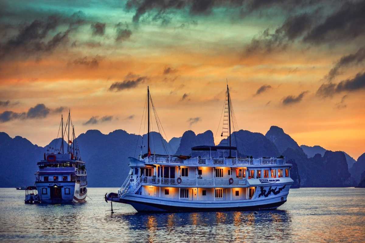 Bo Nau Cave Halong Bay stunning view through cave mouth A breathtaking view through the mouth of Bo Nau Cave, capturing the tranquil waters and limestone peaks of Halong Bay.