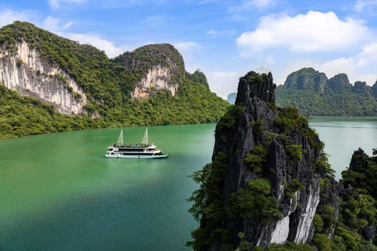 Bo Nau Cave Halong Bay tranquil view from the cave Bo Nau Cave Halong Bay stunning limestone formations and calm waters visible from the cave’s entrance.