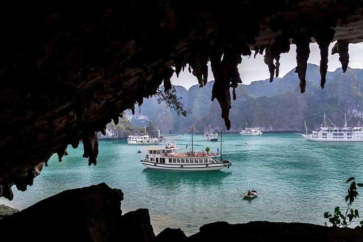 Bo Nau Cave Halong Bay view from inside the cave Inside Bo Nau Cave Halong Bay, visitors enjoy spectacular views of the emerald waters framed by limestone peaks.