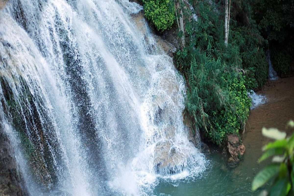 Bobla Waterfall Da Lat close-up cascade water flow Close-up view of Bobla Waterfall Da Lat cascading water surrounded by greenery