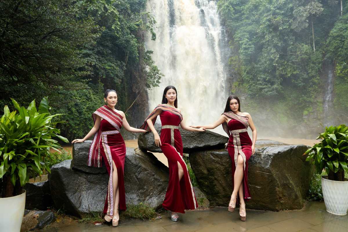 Bobla Waterfall Da Lat young women modeling near falls Young women modeling in elegant traditional dresses near Bobla Waterfall Da Lat surrounded by green foliage