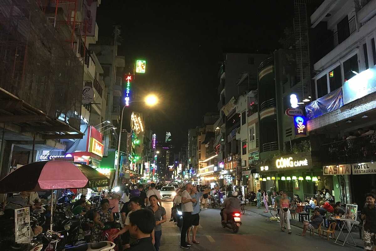 Nightlife Bars and Cafes Along Bui Vien Street Nighttime view of bars, cafes, and neon lights along Bui Vien Street in Ho Chi Minh City.