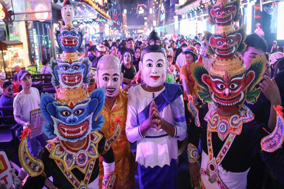 Traditional Vietnamese Performers on Bui Vien Street Costumed traditional Vietnamese performers entertaining crowds on Bui Vien Street at night.