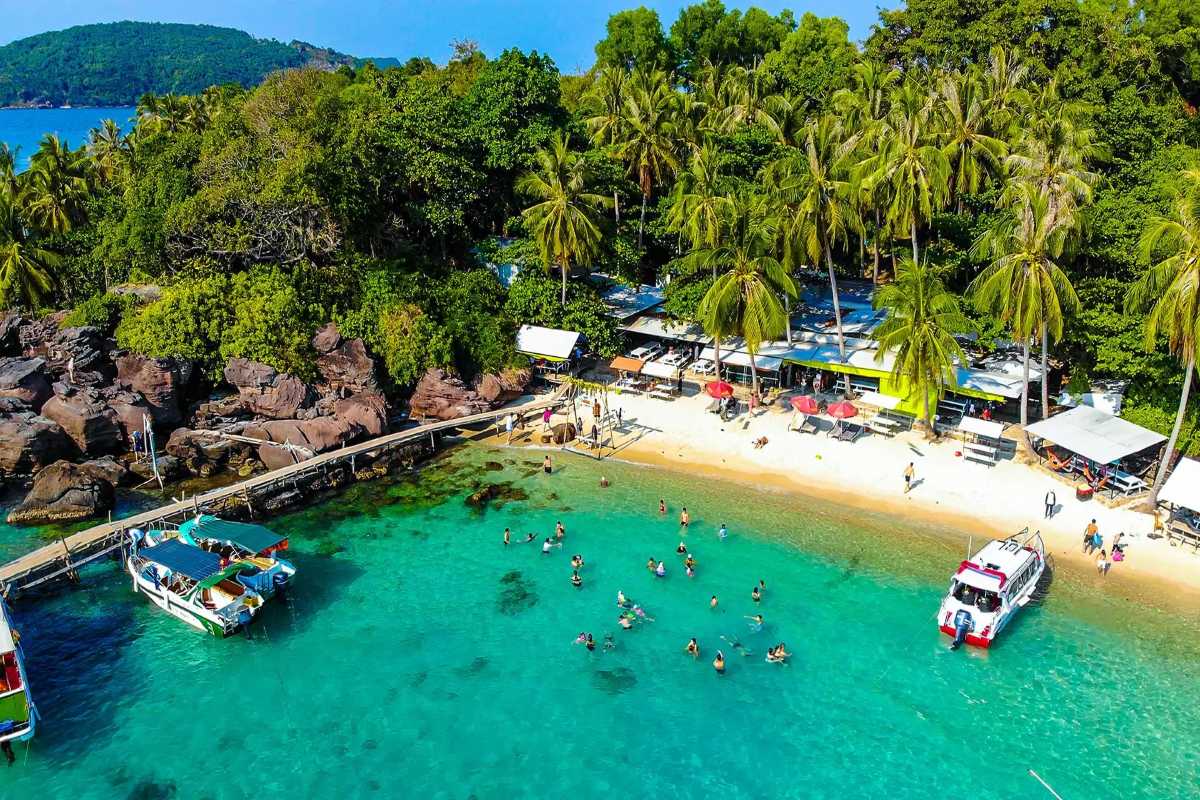 Busy Beach and Jet Skis at May Rut Trong Island Jet skis and visitors enjoying clear waters and beach at May Rut Trong Island in Phu Quoc