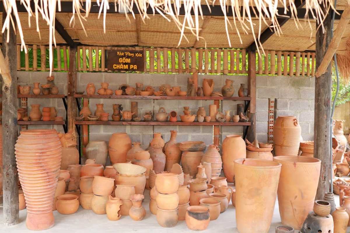 Traditional Cham pottery arranged at a Cai River village studio in Nha Trang featuring handcrafted terracotta items.