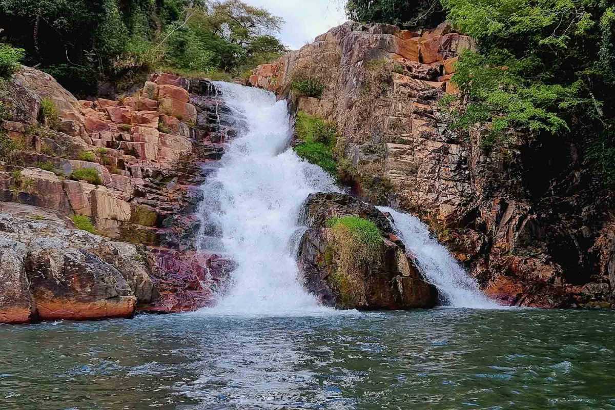 Cam Ly Waterfall Da Lat close-up cascading rocks Cam Ly Waterfall Da Lat close-up showing water flowing over mossy rocks and natural vegetation