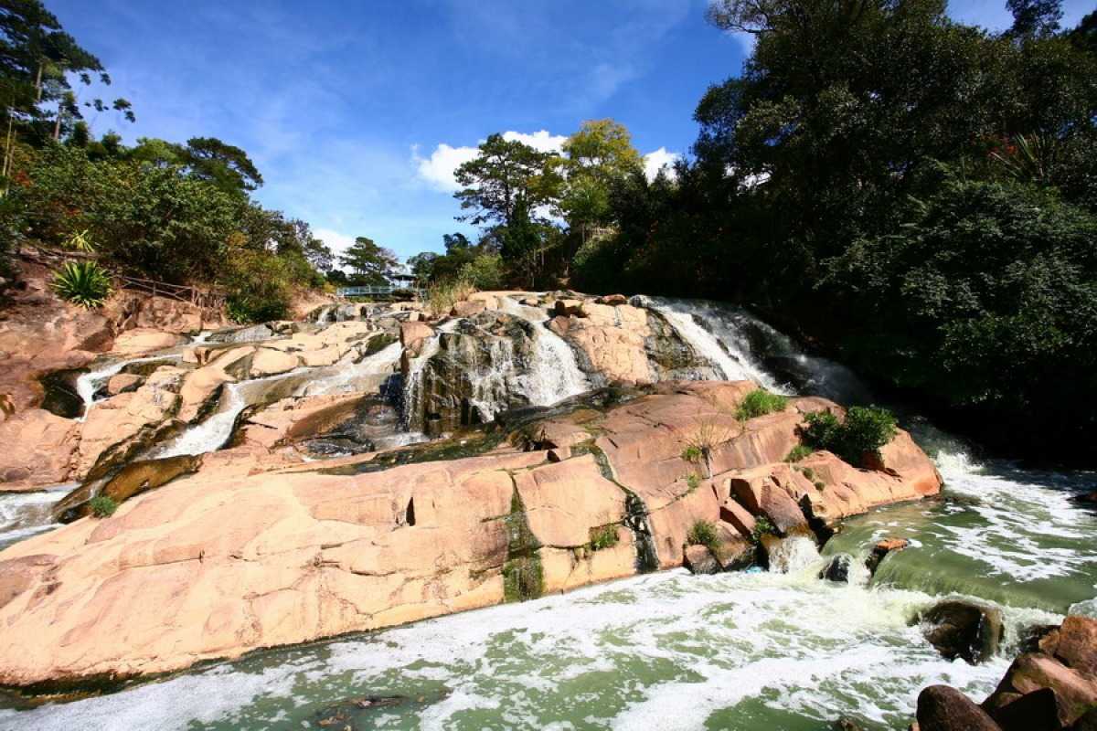 Cam Ly Waterfall Da Lat evening sunlight waterfall Cam Ly Waterfall Da Lat illuminated by soft evening sunlight with lush greenery