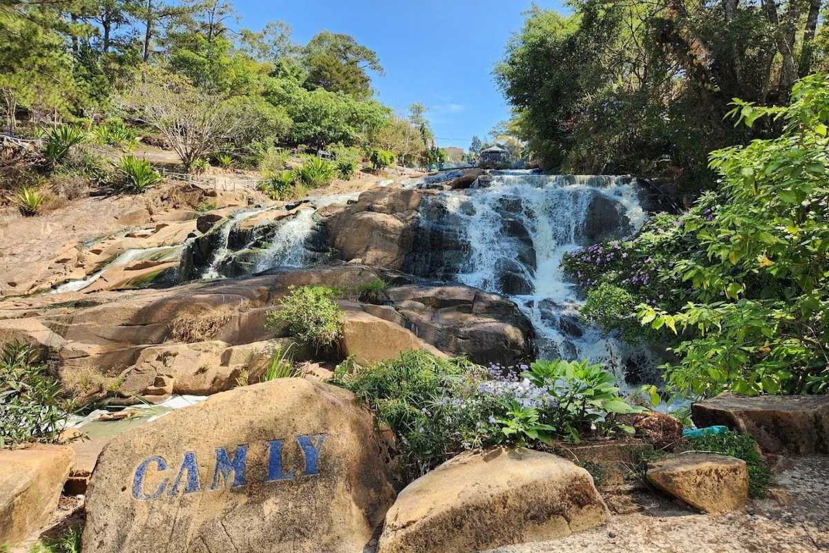 Cam Ly Waterfall Da Lat thrilling zipline over cascade Cam Ly Waterfall Da Lat showing adventure zipline crossing above cascading water and rocky landscape