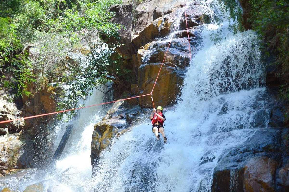Cam Ly Waterfall Da Lat visitor leisure area and waterfall Cam Ly Waterfall Da Lat showing visitors enjoying leisure area near waterfall with pathways and seating