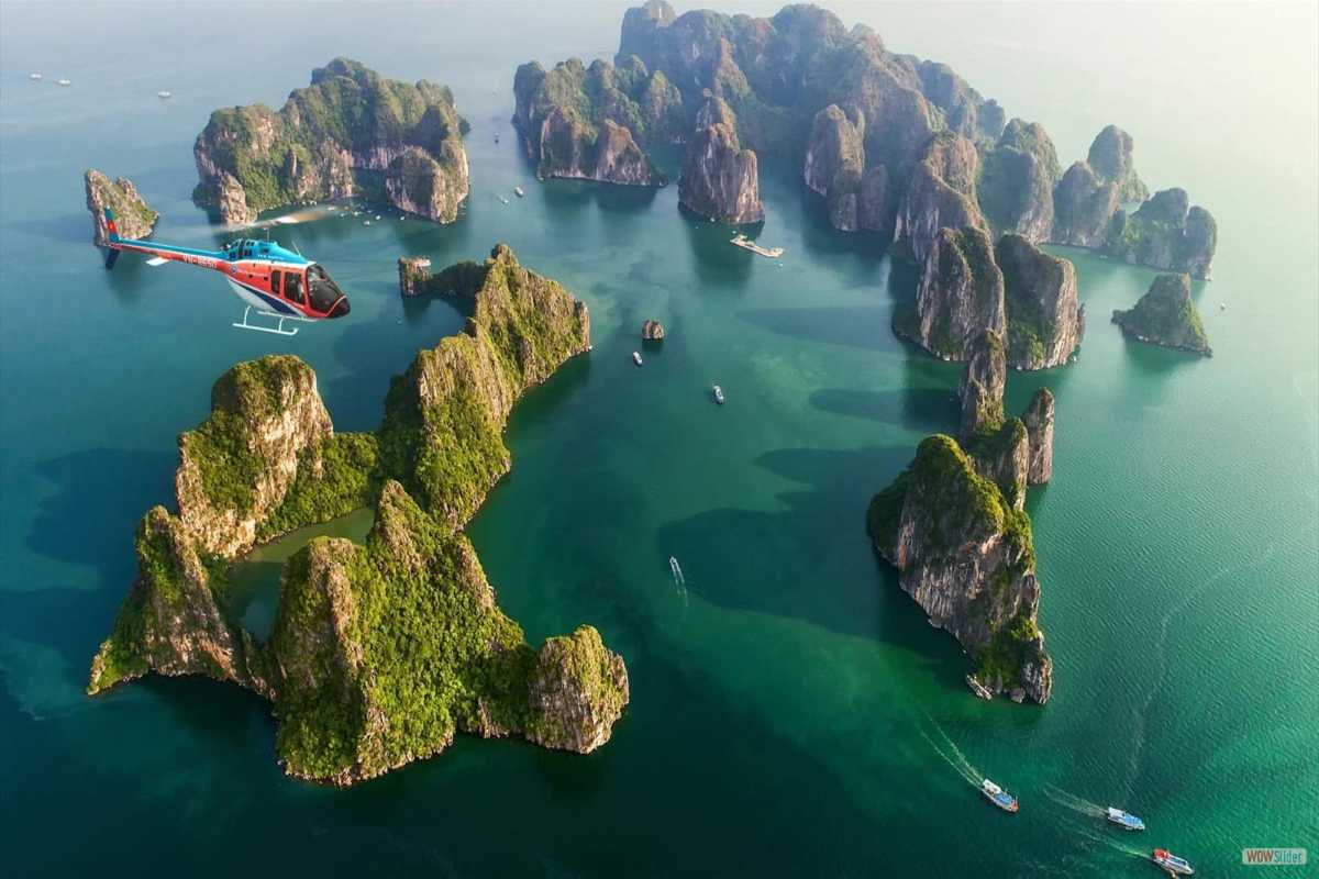 Aerial View of Cap La Island and Bai Tu Long Bay Karst Formations Aerial view of Cap La Island and surrounding karst limestone formations in Bai Tu Long Bay